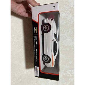 COPO CAMARO 1/24 SCALE WHITE/ ORANGE STRIPE GM CHEVROLET FRICTION MODEL